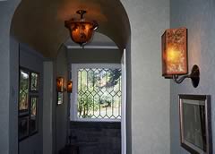  Custom lighting in the entry with natural leaves echo the custom tile floor.